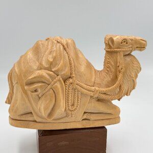 Hand carved Seated Camel in smooth finished blond wood (olive?) Approx. 7" long